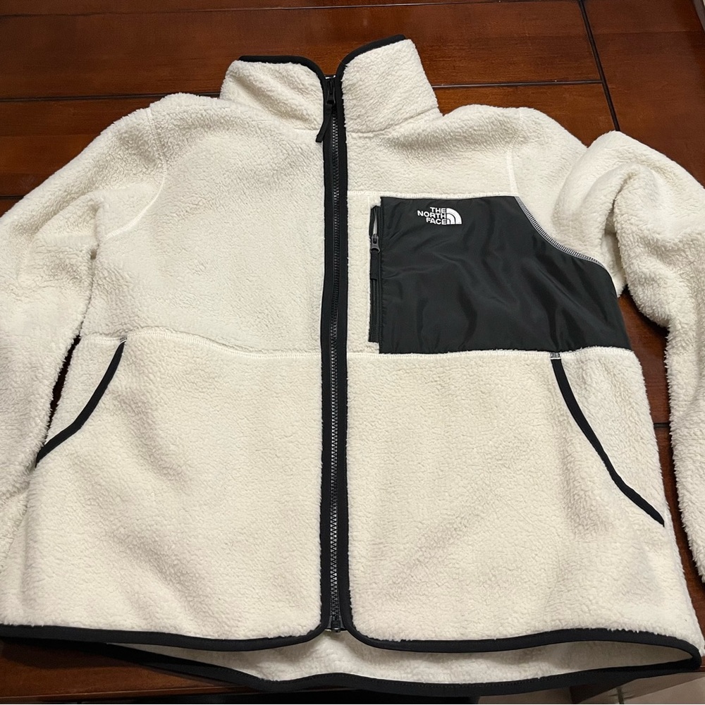 North Face fleece jacket. Cream with black trim. Women’s XL.